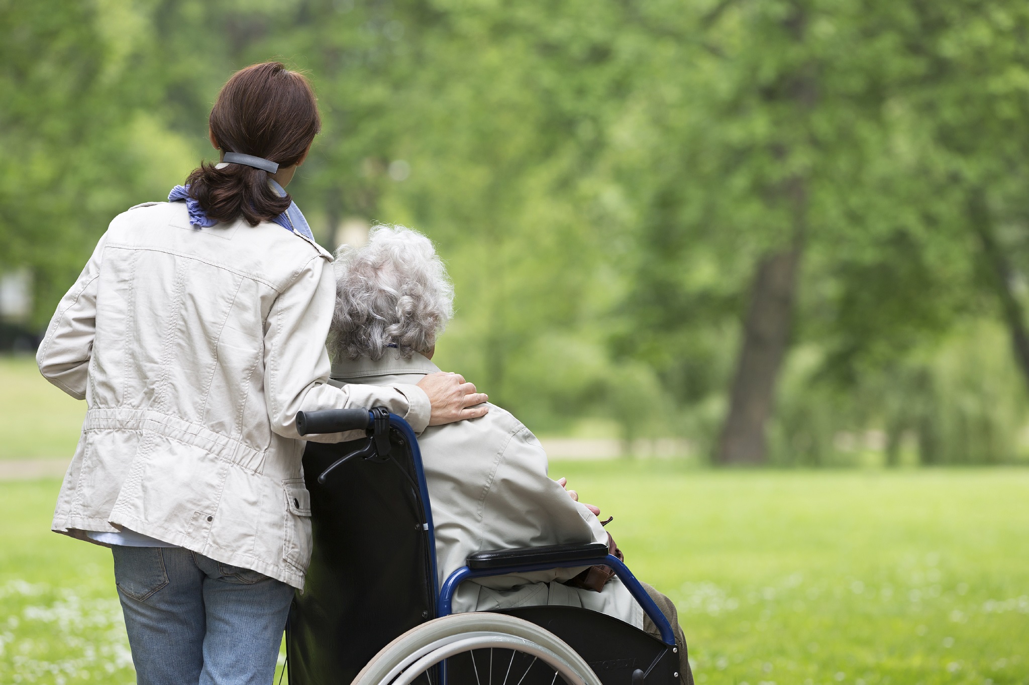 Lady with relative in a wheelchair