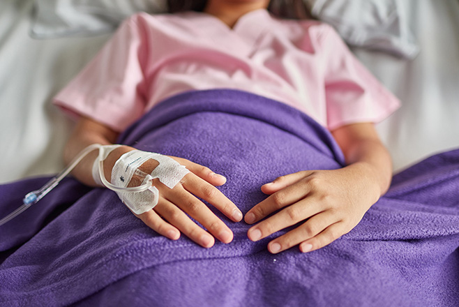 A patient lying in a hospital bed