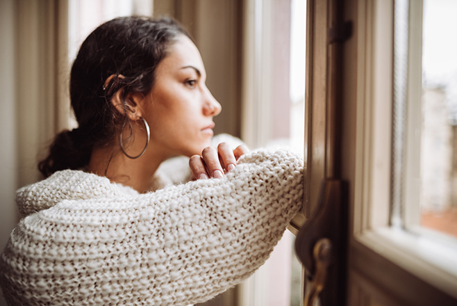 A woman looking out a window