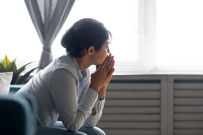 A woman looking out a window